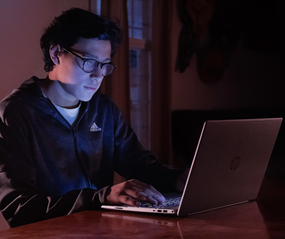 man-in-dark-on-laptop